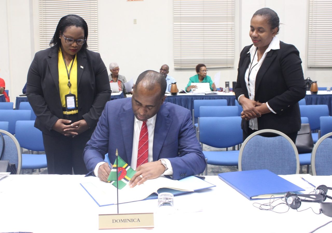 Dominica's Prime Minister Mr Roosevelt Skerrit signs Regional Procurement and Assets Recovery Agreements